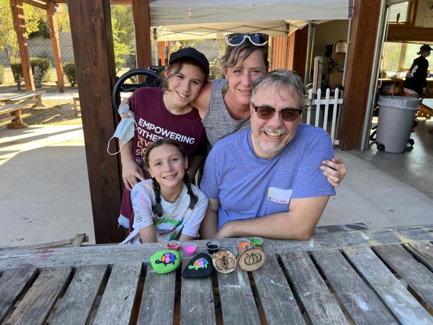 Family on the Dining Hall porch, all smiles at Camp! 
