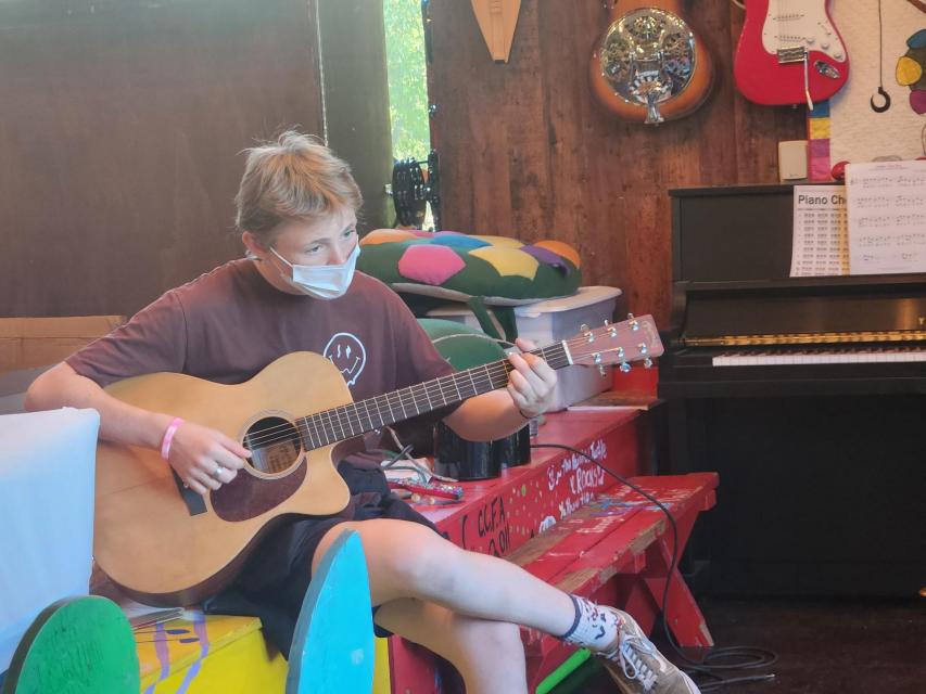 Camper playing Guitar 