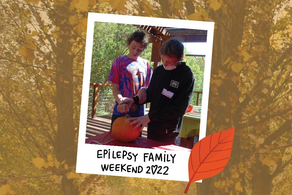 A polaroid of two campers carving a pumpkin