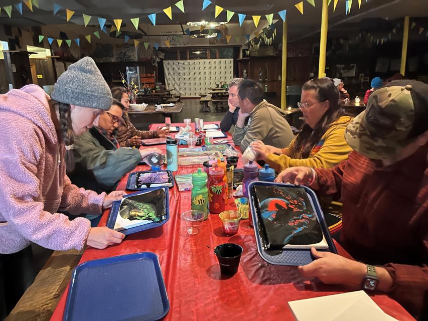 Caregivers painting art at the caregiver cafe Saturday night