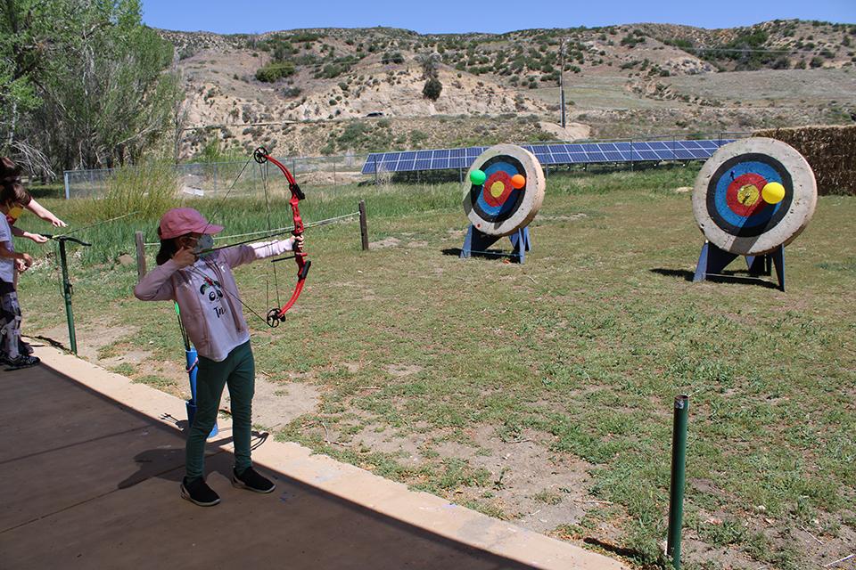 Chloe participating in Archery!