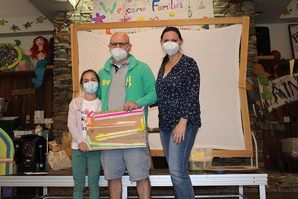 Chloe and family participating in Arts and Crafts at Camp!