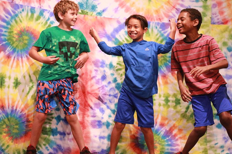 Three boys dancing at Stage Night 
