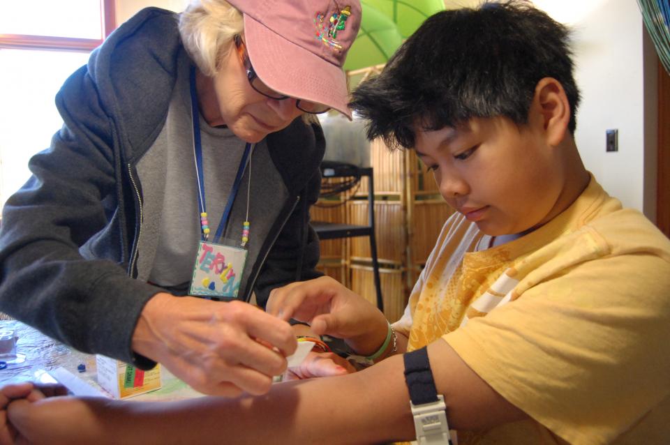 Medical Program nurse administering care. 