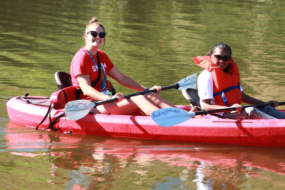 Girls kayaking on the lake.